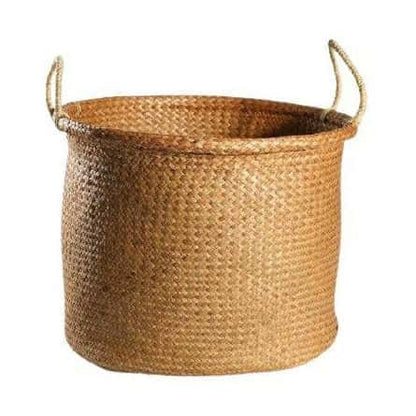 Duży żółty kosz wiklinowy na pranie